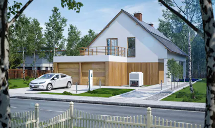 Hus med el-bil parkert foran